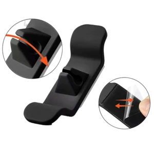 Gancho organizador de cables adhesivo negro con clips para sujetar y dos flechas indicando adhesión.
