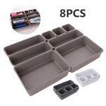Organizador multiusos de 8 piezas gris para cajones, ideal para baño y escritorio.