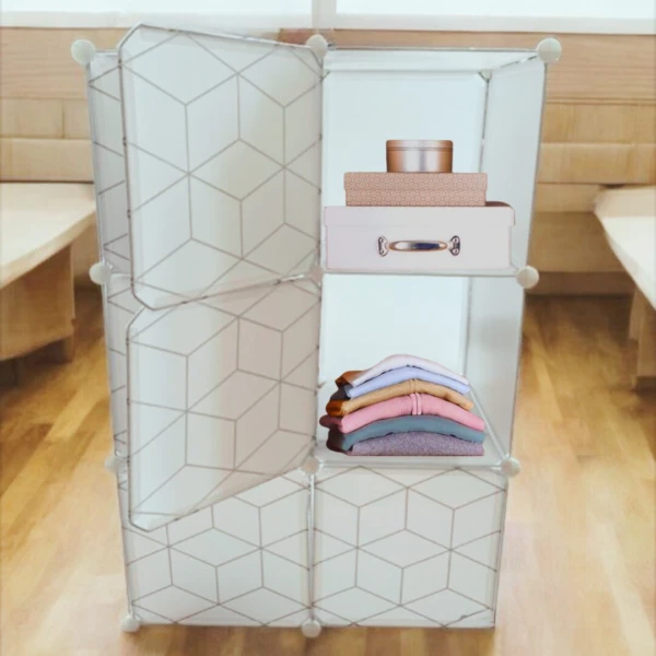 Armario organizador blanco de 6 módulos con ropa doblada y cajas apiladas.
