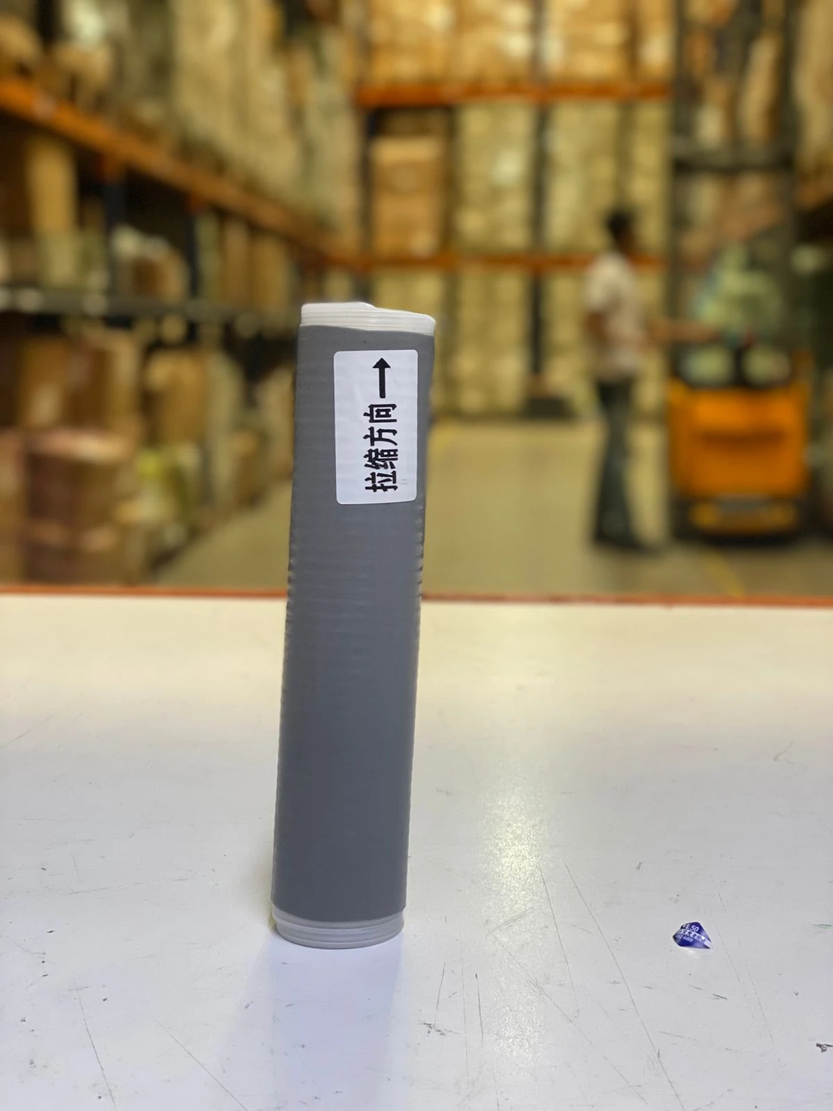 Funda de silicona para olla X3, detalle de etiqueta con flecha y texto en chino.