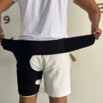 Soporte de ciática negro para pierna y cadera, ajustable para alivio del dolor.