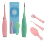 Cepillo eléctrico 3 en 1 para limpieza dental y facial, rosa y verde.