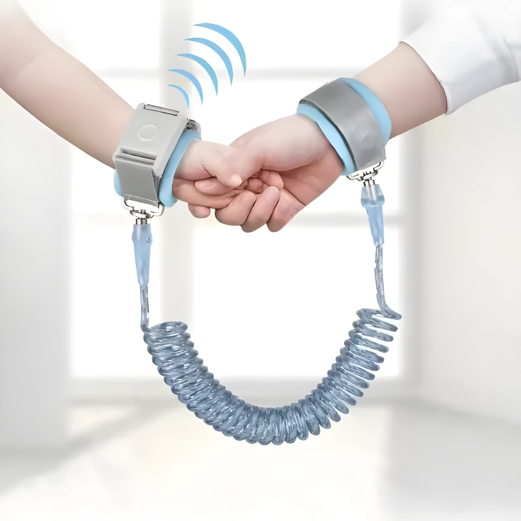 Arnés muñequera anti-pérdida para niños, conecta muñecas con cordón retráctil seguro.