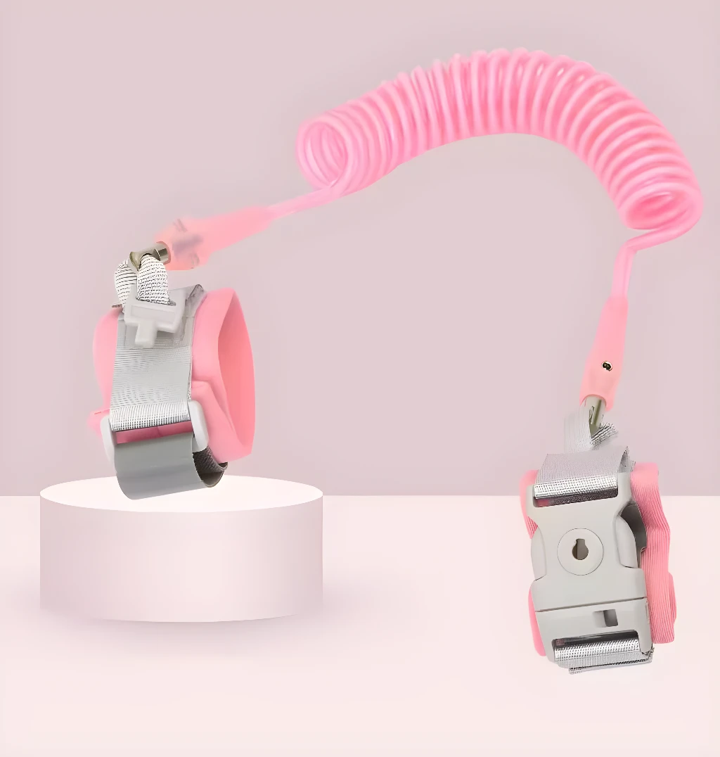 Arnés muñequera anti-pérdida rosa con correa extensible para niños y bebés.