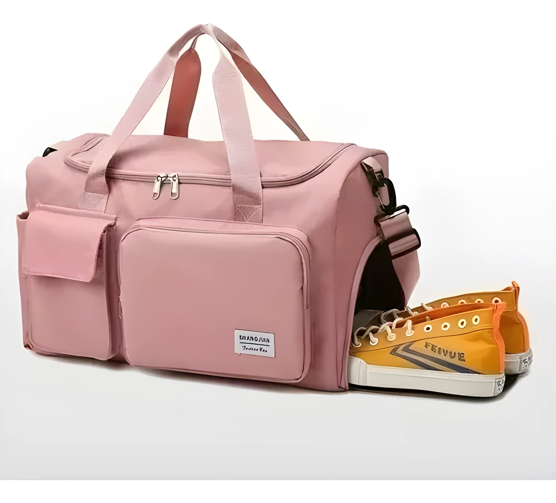 Bolso bandolera de viaje rosa con compartimento lateral para zapatillas deportivas.