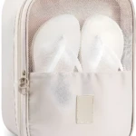 Bolso organizador de viaje beige para zapatos y ropa, con compartimento transparente.