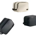 Bolso organizador de almacenamiento negro y beige con cremallera y asa, ideal para viajes.