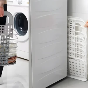 Cesta plegable multiusos gris con ropa y lavadora.