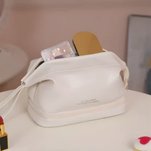 Cosmetiquera doble compartimiento blanca, con sombras de ojos y espejo, ideal para organizar maquillaje.