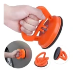 Set de 2 extractores ventosa naranja para saca golpes en carrocerías de autos.