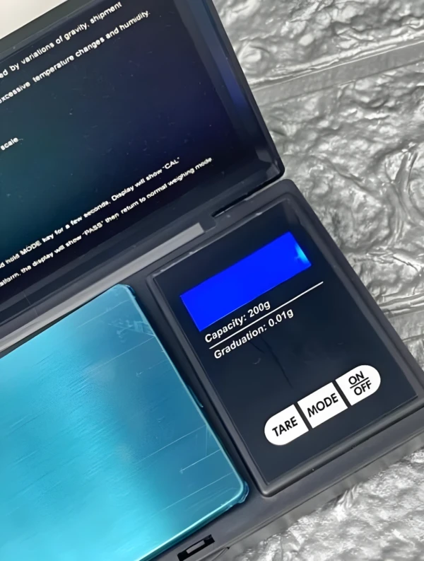 Gramera digital A2403-581, capacidad 200g, graduación 0.01g, pantalla azul brillante.