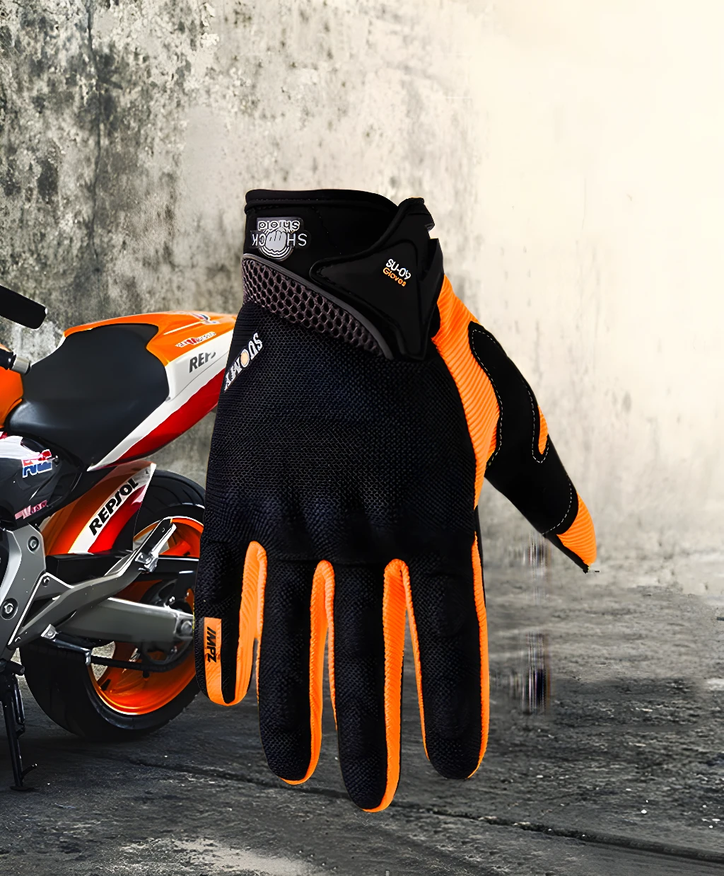 Guantes de moto impermeables SU09 negros y naranjas con protección de impacto y diseño deportivo.