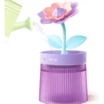 Humidificador de aire flor regando con agua, diseño morado y rosa, difusor aromático.