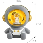 Lámpara Alcancía Astronauta con detalles espaciales, 16x17x12cm.