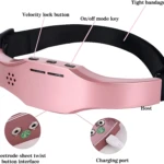 Masajeador eléctrico de cabeza rosa con interfaz de electrodo, puerto de carga y bandas ajustables.