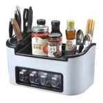 Organizador de cocina para ingredientes, granos y utensilios, con frascos y cubiertos.