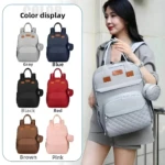 Pañalera gris moderna con monedero colgante, ideal para mamás.