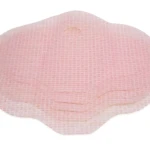 Parche abdomen rosado con textura de rejilla y borde ondulado.