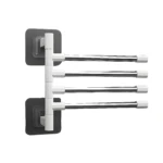 Rack de toallas giratorio plateado de 4 barras con base adhesiva gris.