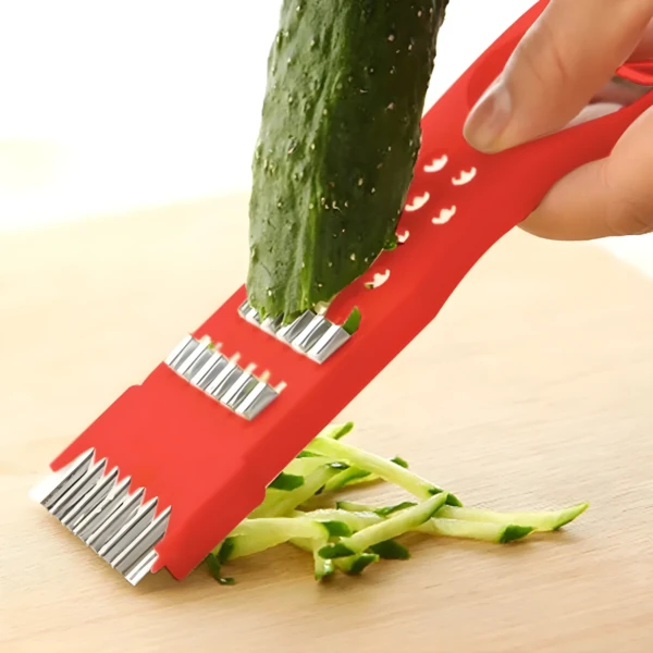 Rebanador de verduras 5 en 1 inoxidable cortando pepino en julianas finas.