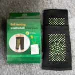 Rodilleras elásticas negras con puntos verdes autocalentables de artemisa.