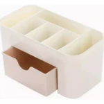 Organizador de maquillaje blanco con compartimentos y cajón beige, ideal para cosméticos.