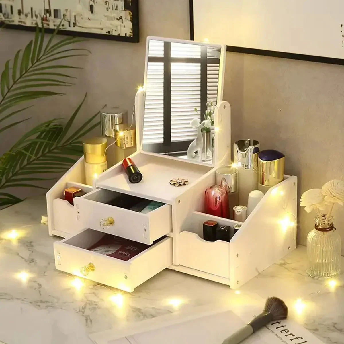 Organizador de maquillaje y joyas grande con espejo, cajones y luces decorativas.