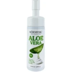 Espuma facial limpiadora Kormesic con aplicador de cepillo, envase blanco con diseño de aloe vera.