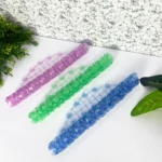 Tapetes de baño de succión translúcidos en morado, verde y azul.