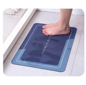 Tapete de baño azul absorbente de agua, 60x40 cm, con huellas de pies.