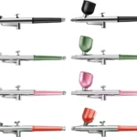 Aerógrafos portátiles profesionales con depósito y mango de diferentes colores: negro, verde, rosa y rojo.