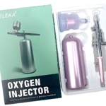 Aerógrafo Inyector de Oxígeno portátil VELEKA color rosa metálico en su empaque.