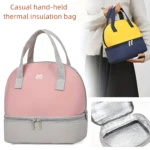 Bolso nevera rosa y gris de dos compartimentos, ideal para leche materna, con asas y logo.