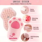 Cepillo rosa con forma de pata de gato, detalles de spray, carga USB y función de vapor para mascotas.
