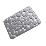 Tapete de baño gris con textura de piedras redondeadas, antideslizante y suave.