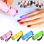 Mini linterna UV LED rosa para secado de uñas, se muestran variantes en amarillo, azul y verde.