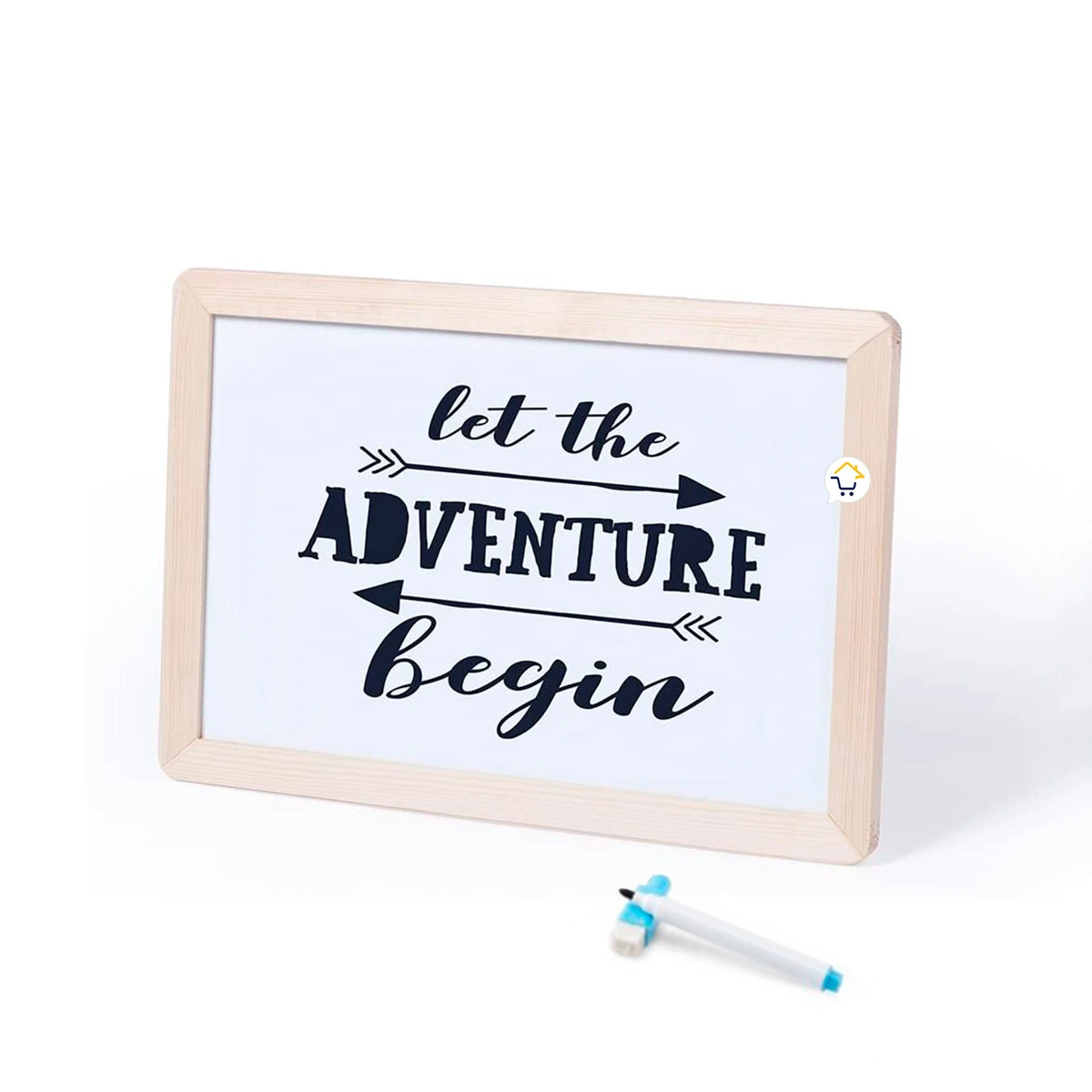 Tablero didáctico blanco con marco de madera clara y frase "Let the adventure begin" escrita en negro.