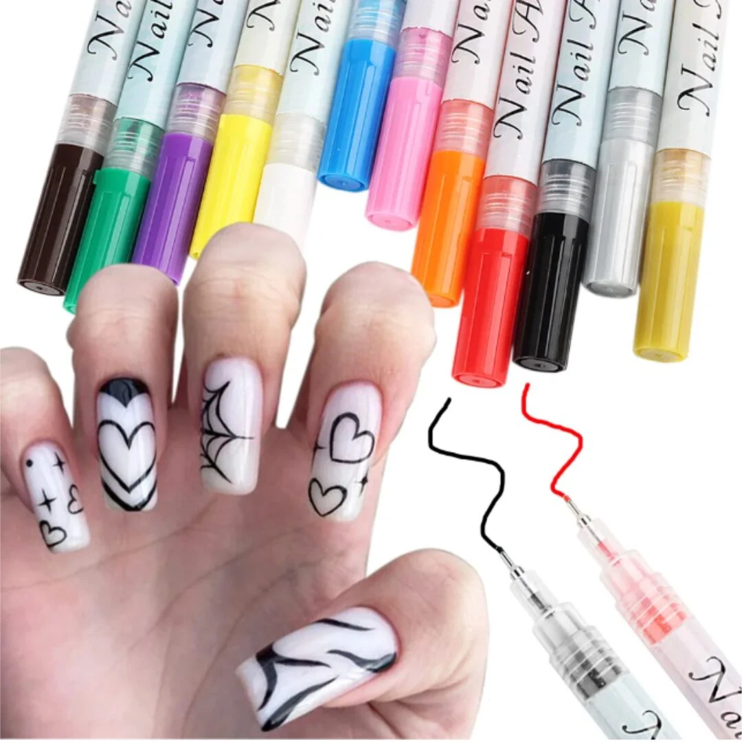 Set de bolígrafos para diseño de uñas con punta fina y diversos colores, mostrando una mano con arte lineal en las uñas y trazos de prueba sobre fondo.