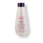 Botella de Tratamiento Capilar Fruto Salvaje, blanca con tapa morada, para todo tipo de cabello.