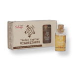 Frasco de vidrio con tónico capilar vigorizante Fruto Salvaje y caja de cartón, ambos con logo de sol y espiral.