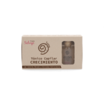 Caja de Tónico Capilar Crecimiento Fruto Salvaje con frasco de vidrio y corcho, color beige.