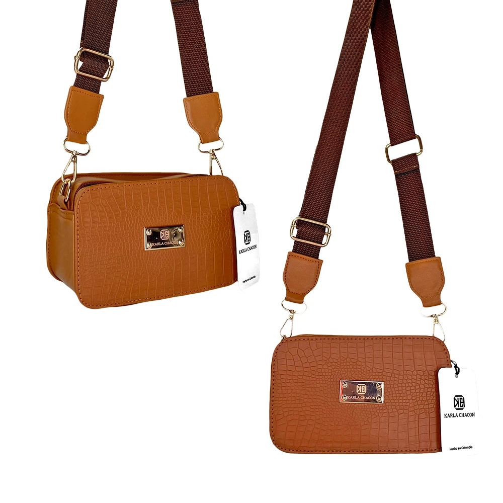 Dos bolsos pequeños tipo bandolera, piel sintética textura cocodrilo color miel con correa ancha marrón y herrajes dorados.