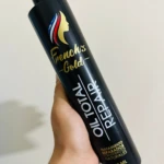 Botella negra de 500ml French's Gold Oil Total Repair, para cabello, con logo dorado y tapa.