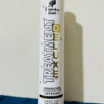 Botella blanca de tratamiento capilar intensivo "French's Gold" con tapa dorada.