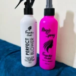 Dos botellas de spray capilar, una blanca y otra rosa, ambas con etiqueta French's Gold.