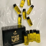 Caja de ampolletas "Hair Life Shot" de French's Gold con líquido capilar en frascos pequeños y envase negro.