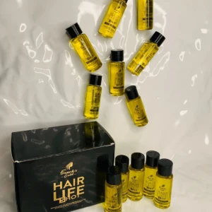 Caja negra con 12 ampolletas de aceite capilar dorado "Hair Life Shot".