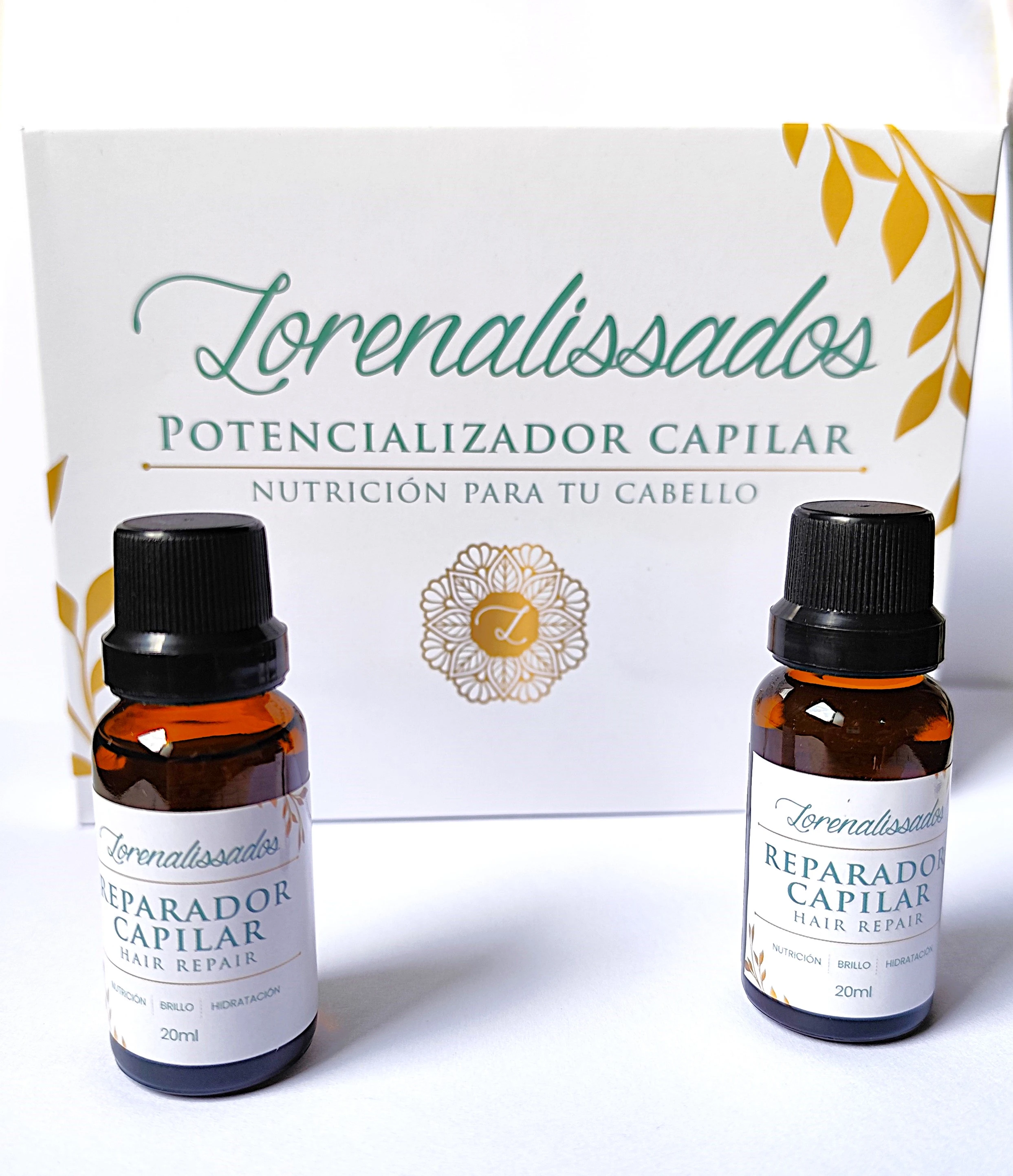 Dos frascos ámbar de 20ml de tratamiento capilar con tapa negra. Caja blanca con diseño de hojas doradas.
