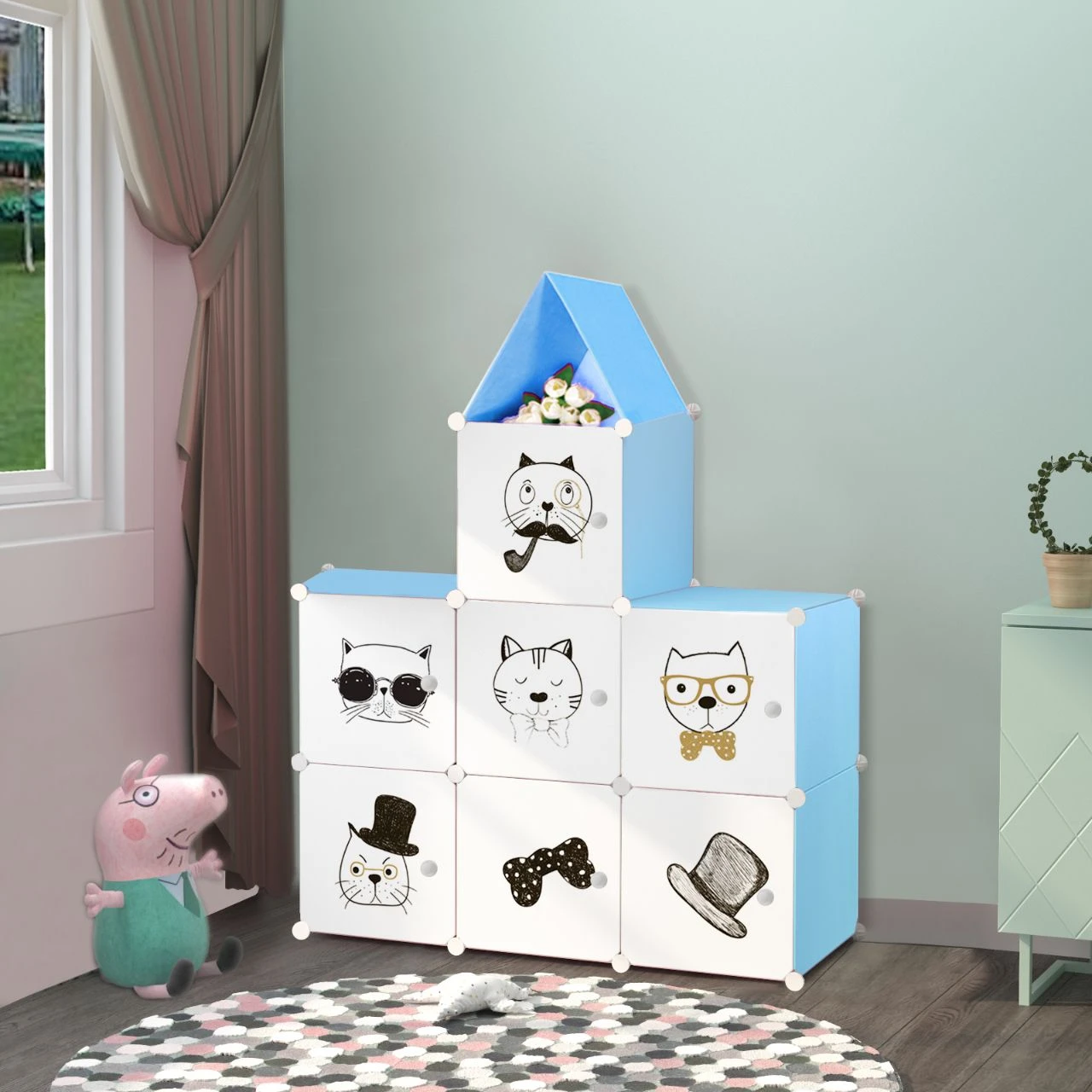 Armario organizador de tela azul y blanco con diseño de gatos, ideal para ropa y juguetes.