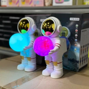 Lámparas astronauta blancas con esferas luminosas (azul y magenta), parlante Bluetooth, Radio FM.